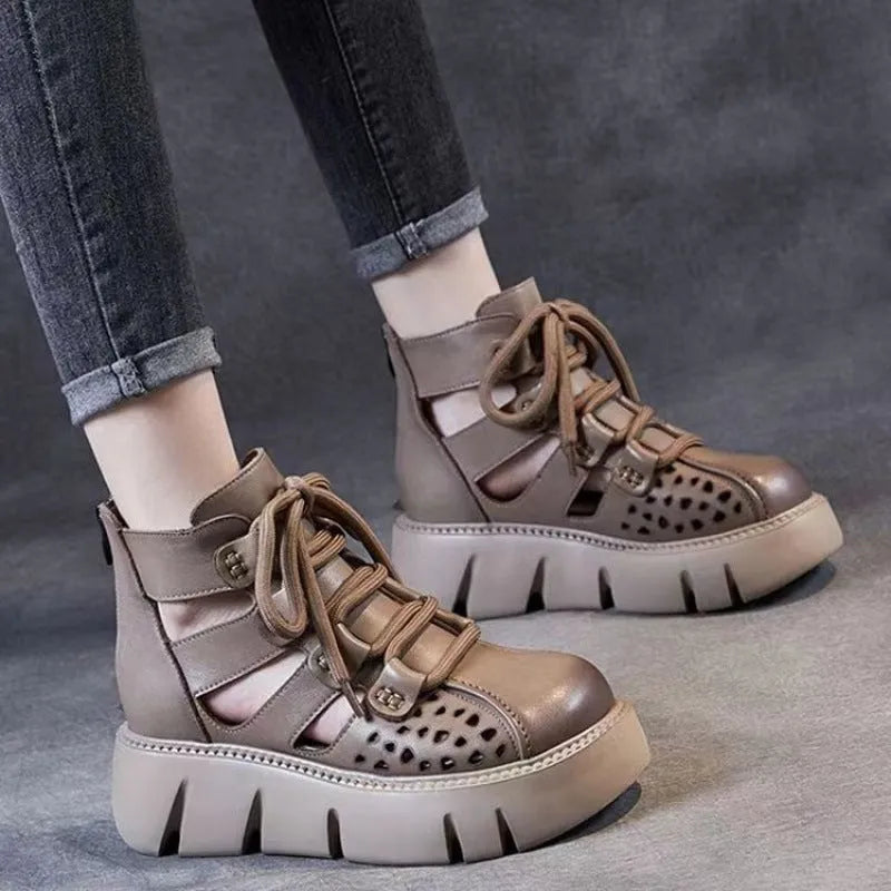 Women's black platform sandals with a hollow-hole leather upper and fish-mouth toe.