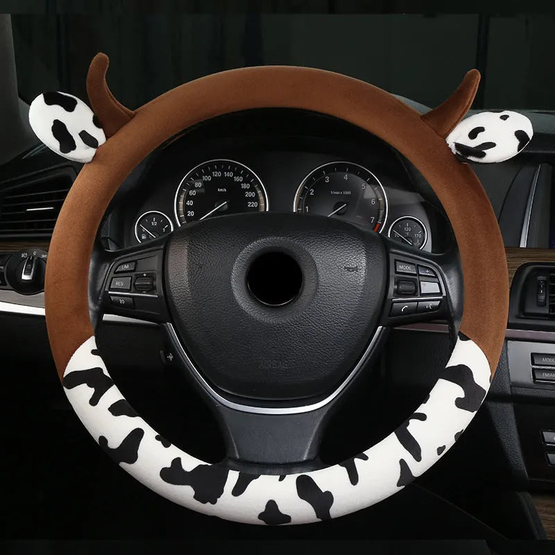 Short plush automotive steering wheel cover in black colour with protective handle design