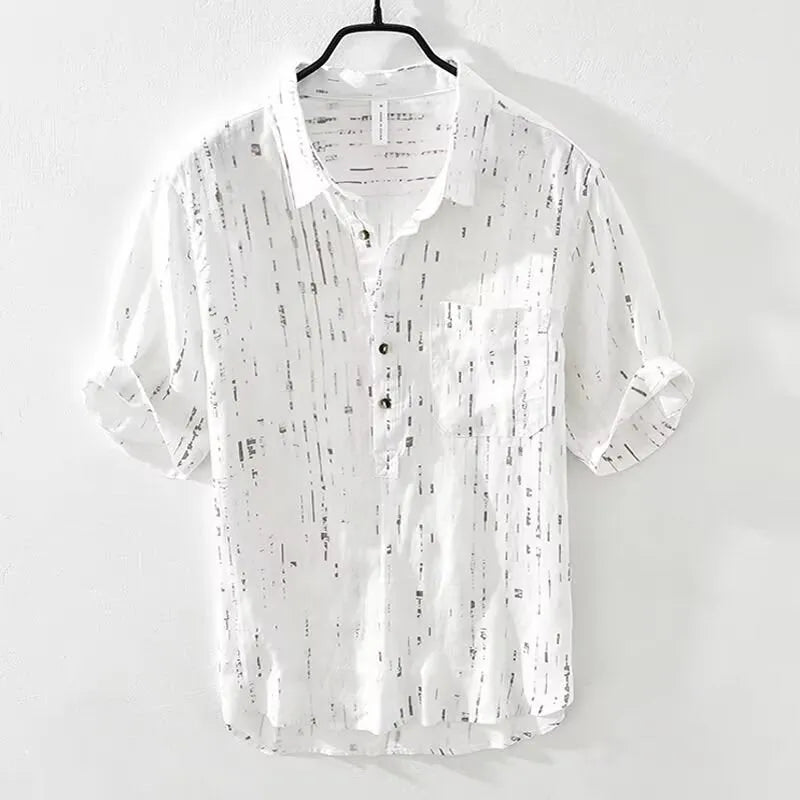 Men's black loose-fit short-sleeved polo shirt with a lapel collar on a hanger.