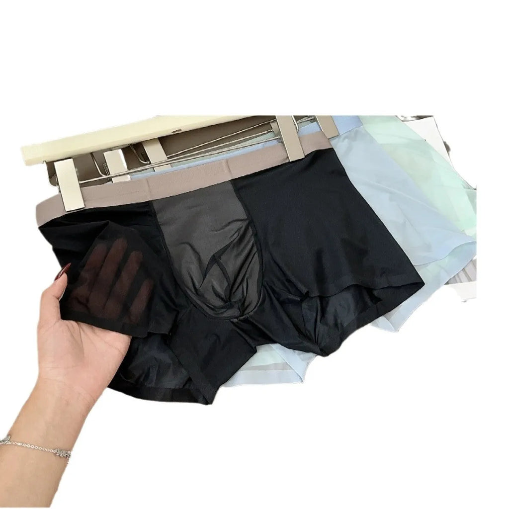 Seamless men's boxer shorts in ice silk fabric showing the honeycomb crotch design and mid-waist fit.