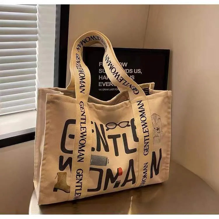 Large capacity canvas tote bag with printed letter design for women's travel and shopping