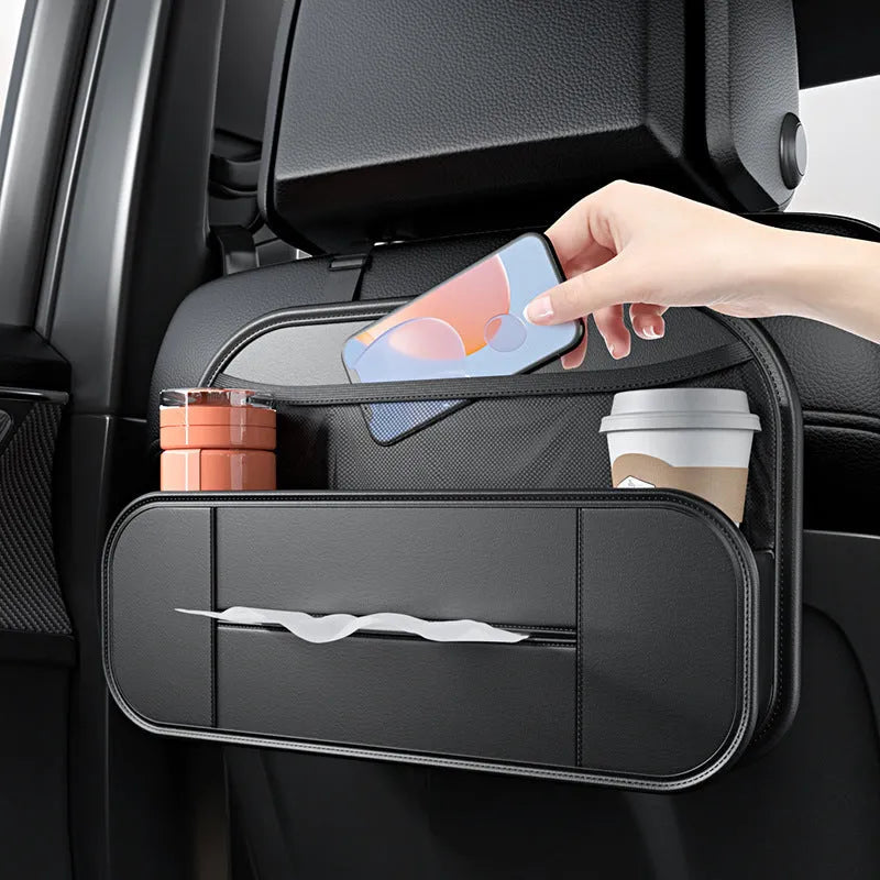 Black leather storage bag attached to the back of a car seat for organisation.