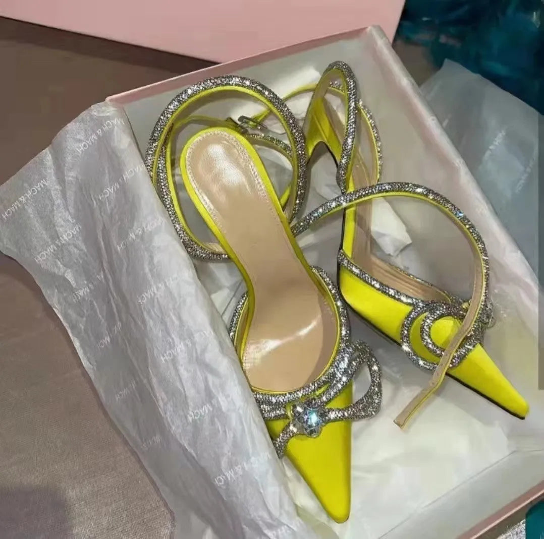 Women's stiletto heel sandals with a silk bandage back, buckle strap, and pointed toe in various colours.