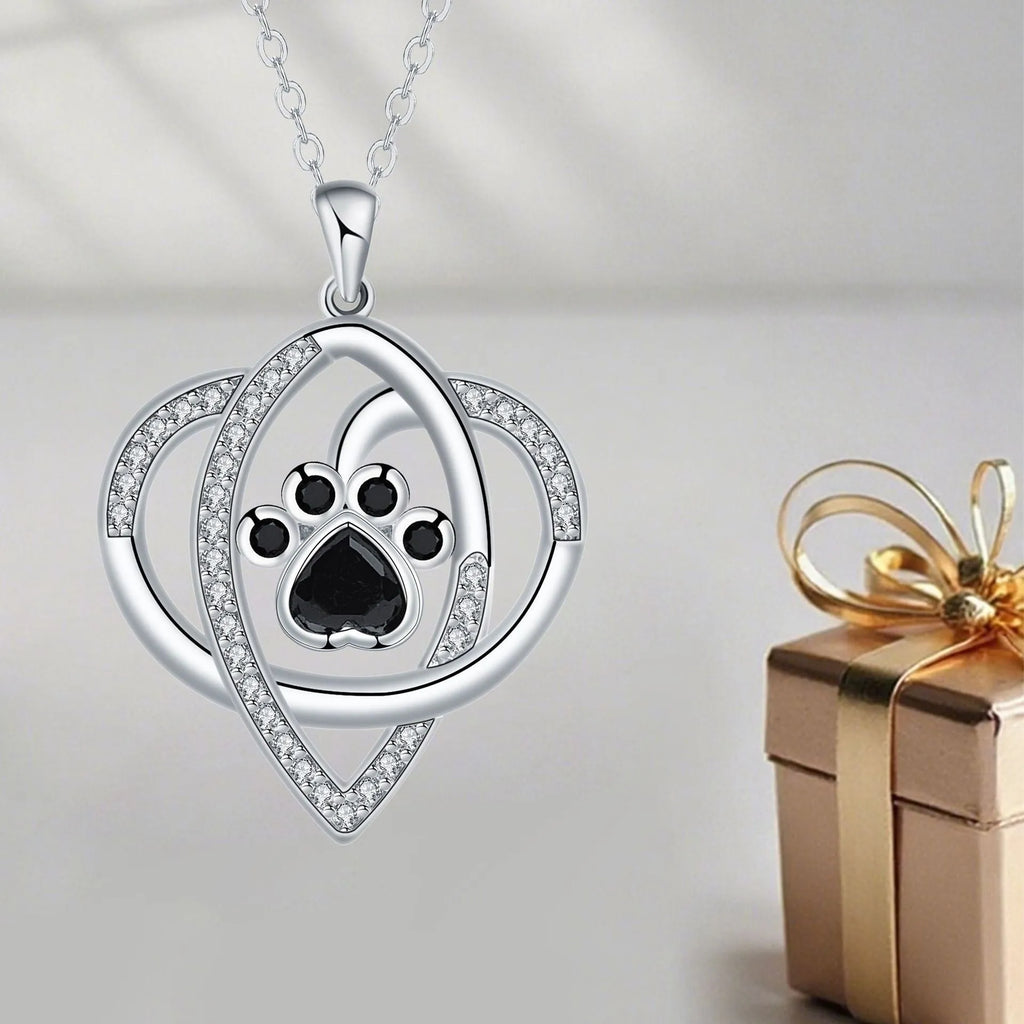 Copper necklace with cat and dog paw prints pendant on a cross chain, electroplated finish.