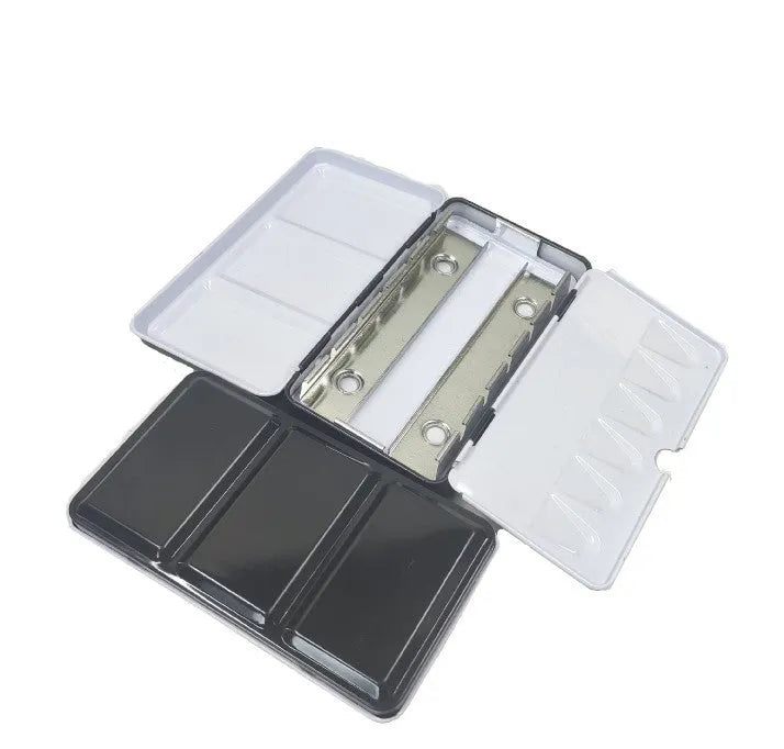 Three-fold tinplate watercolour paint box showing folding mechanism and square shape