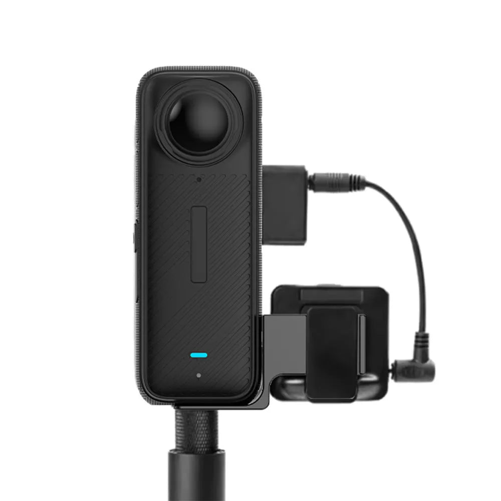 Black aluminium microphone extension bracket with adapter cable on table