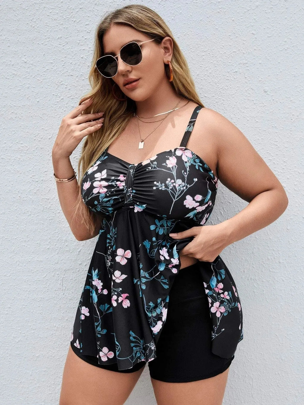Women's floral print split colour one-piece swimsuit on hanger showing front design details