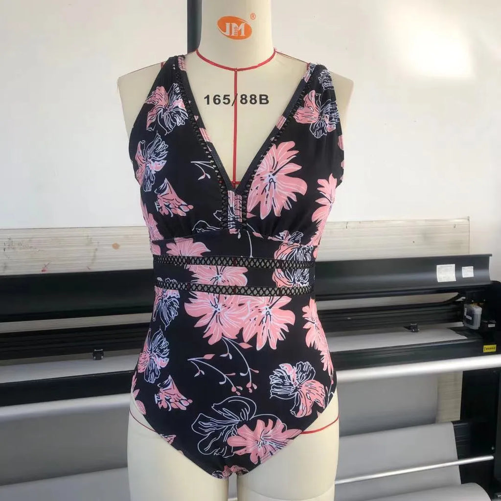 Black plus size women's swimsuit with all-over print pattern and mesh fabric stitching details