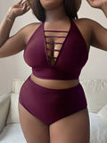 Plus-size woman in a black halter bikini with adjustable cross straps and high-waist briefs.