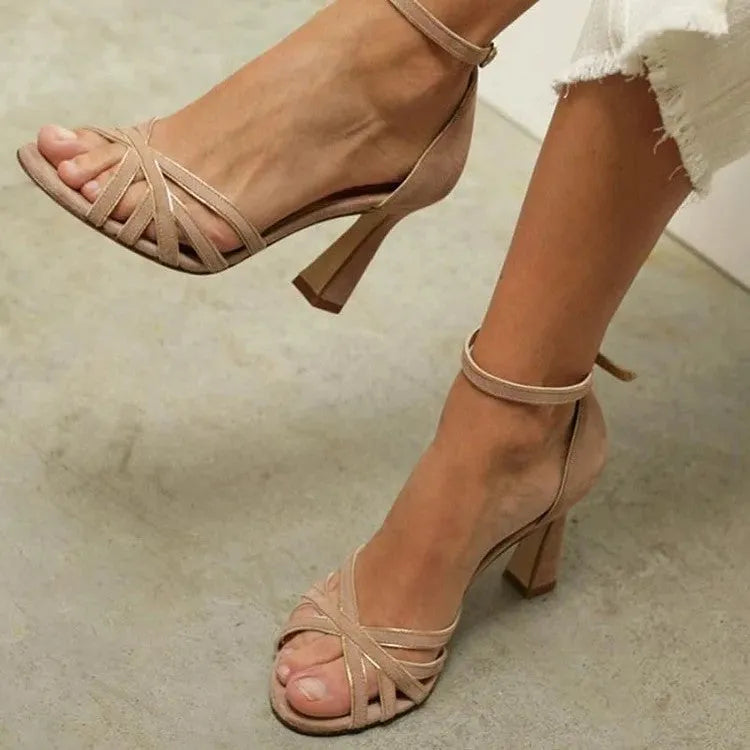 Apricot coloured suede women's peep toe high heel sandals with a fish mouth toe design.