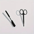 Black pet grooming brush with soft silicone bristles and comb section for dogs and cats