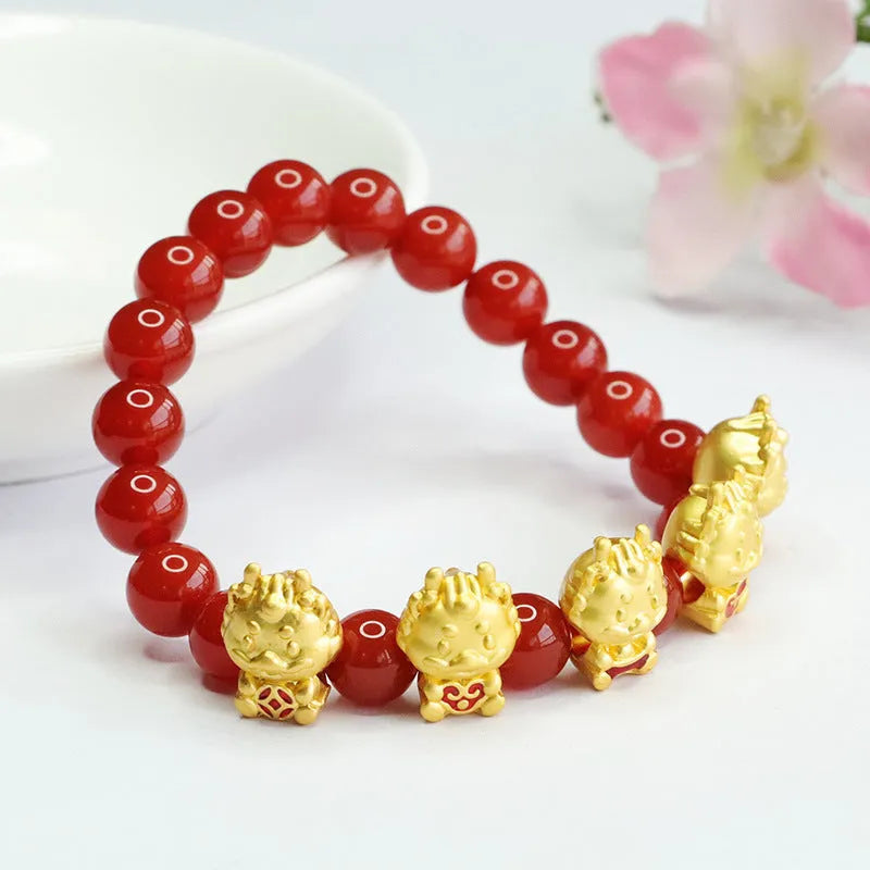 Close-up of a red agate bracelet with a carved five blessing dragon motif on 8mm beads.