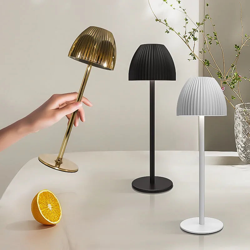 Modern dimming desk lamp in black or white with a thin round base and USB cable.