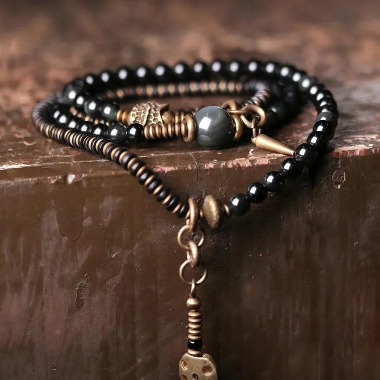 Black geometric multi layered bead bracelet with retro colourful beads on adjustable strap