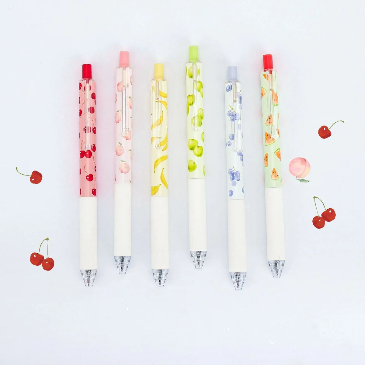 Three fruit scented pressurised pens with 0.5mm black ink and press-action mechanism
