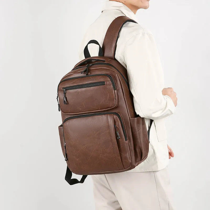 Large capacity men's black business commute backpack in composite cowhide PU with 20-35L capacity and curved shoulder straps