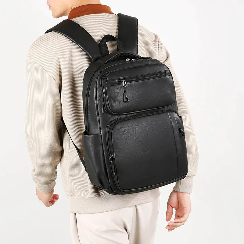 Large capacity men's black business commute backpack in composite cowhide PU with 20-35L capacity and curved shoulder straps