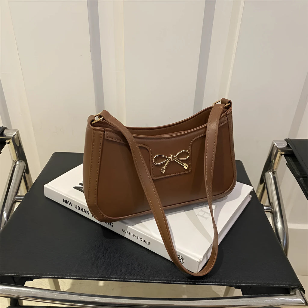 Western style baguette shoulder bag in six colours with 24x14x5cm dimensions and single strap