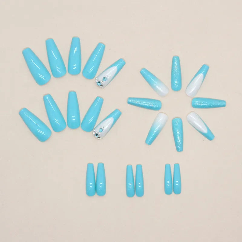 Long oval ballet false nail art patches with a solid smart blue diamond design and glue bottle.