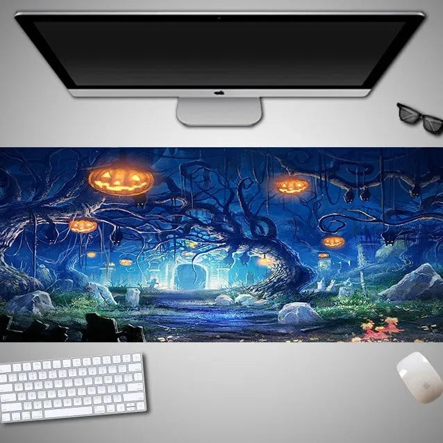 Oversized Halloween-themed gaming mouse pad on a desk, showing non-slip rubber cloth base.