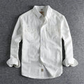 Men's solid colour cotton long sleeve button-down shirt in light blue on hanger