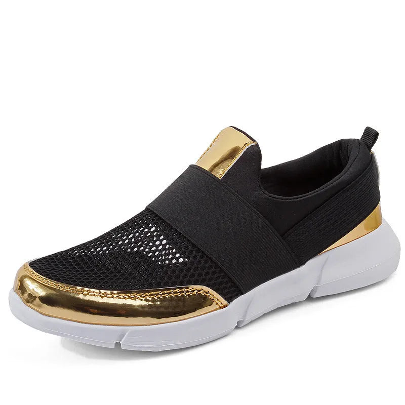 Women's low-cut casual sneakers in grey with mesh detail and PU midsole on a hard floor.