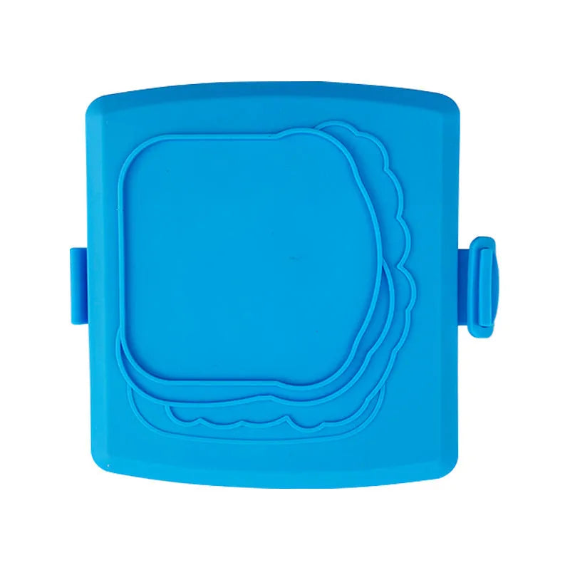 Red silicone baking tray with matching anti-scald gloves on kitchen counter