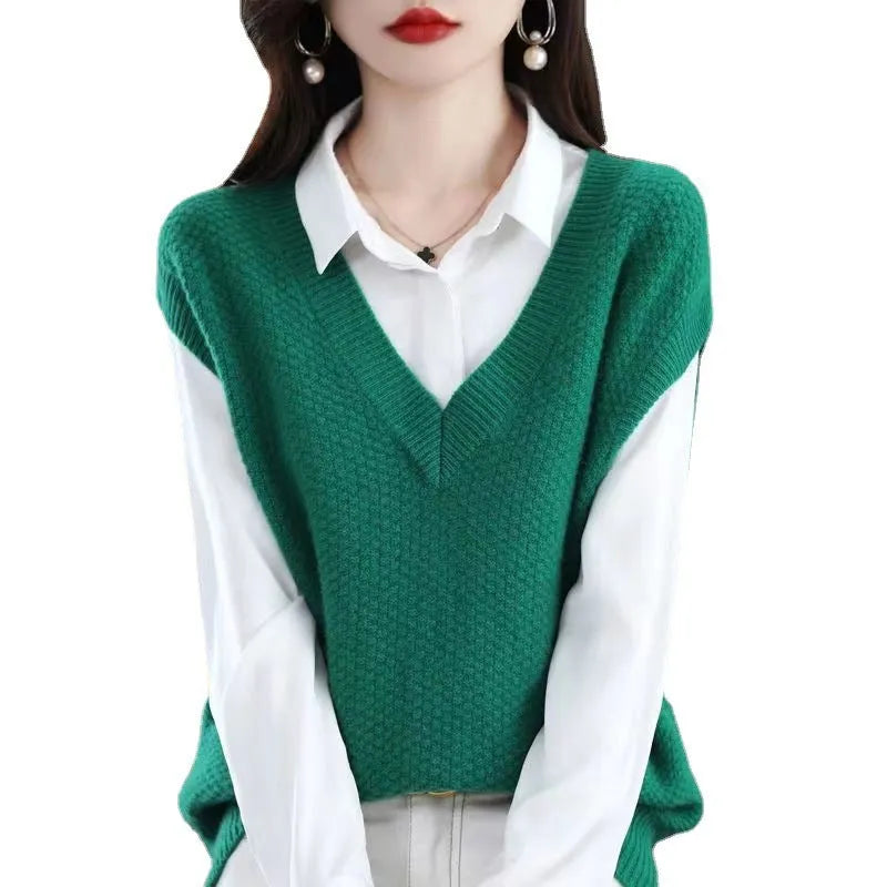 Women's creamy-white v-neck sleeveless pullover vest with a raised 3D knitted pattern texture