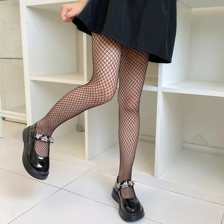Women's black and white mesh stockings showing large, medium and small net patterns on thin velvet fabric