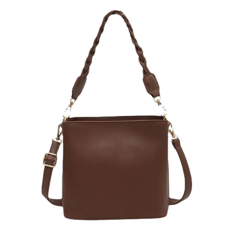 Retro unisex woven PU crossbody bucket bag shown in khaki colour.