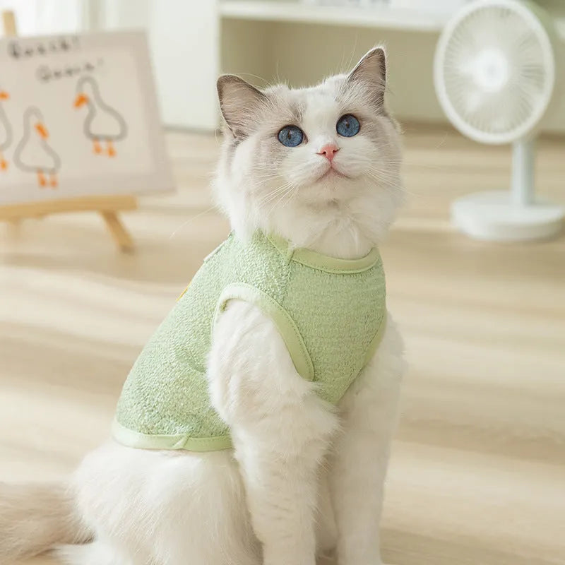 Green cat clothes with hollowed-out bear patch design made from knitted fabric