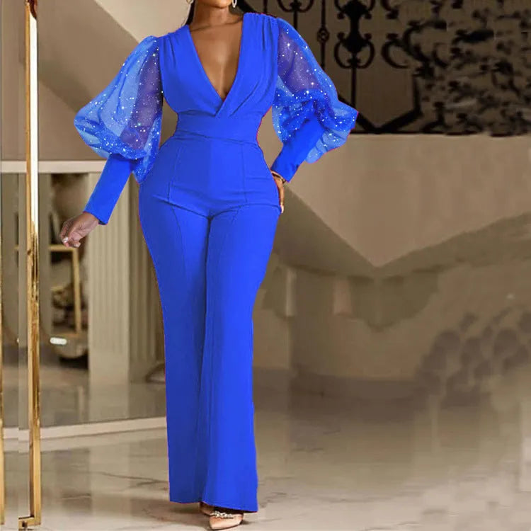 Red mesh stitching long sleeve jumpsuit with elastic waist and wide leg design laid flat