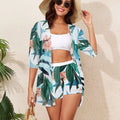 Three-piece bikini swimsuit set with printed split strap tube top, briefs, and sun protective blouse in white, black, or blue