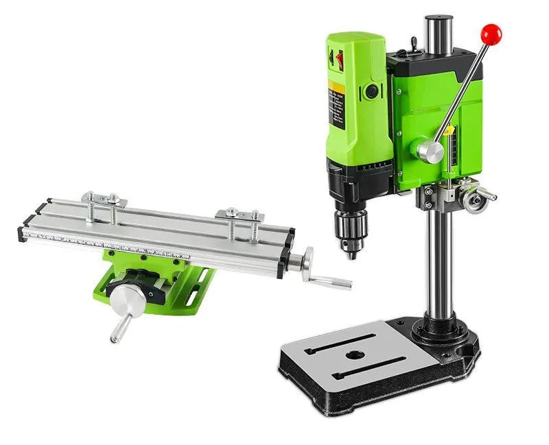 Bench drilling and milling machine with cross bench pliers and heavy duty bench pliers on a workshop table