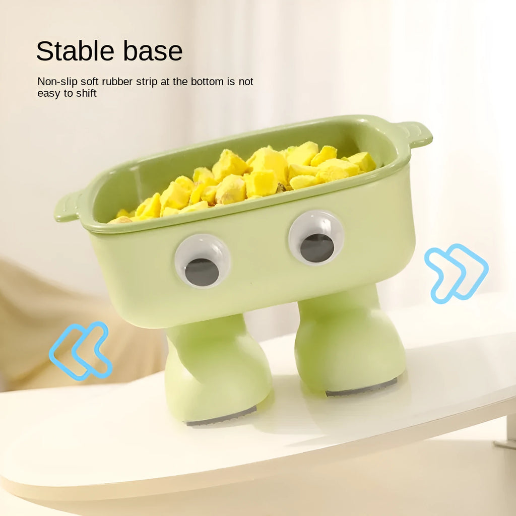Green cartoon robot shaped elevated cat bowl with a tilted, detachable inner food dish.