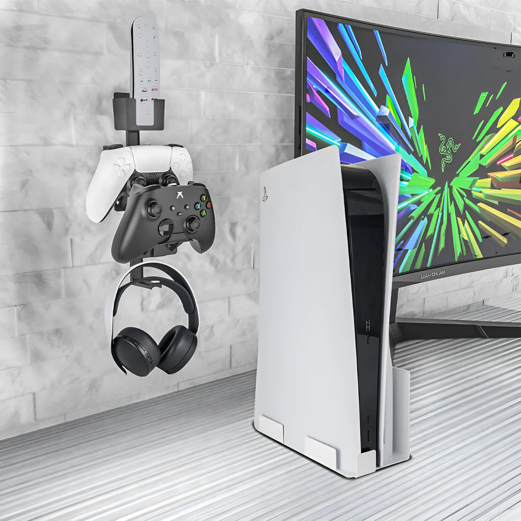 White wall-mounted plastic hook holding a game controller and a TV remote control.
