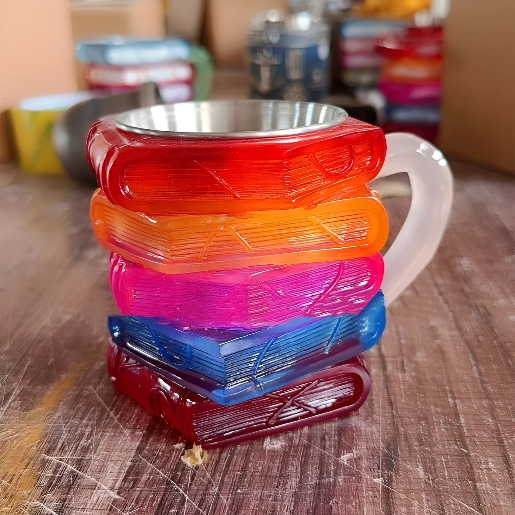 A decorative synthetic resin mug with a painted bookmark design on its side, shown in Library style.