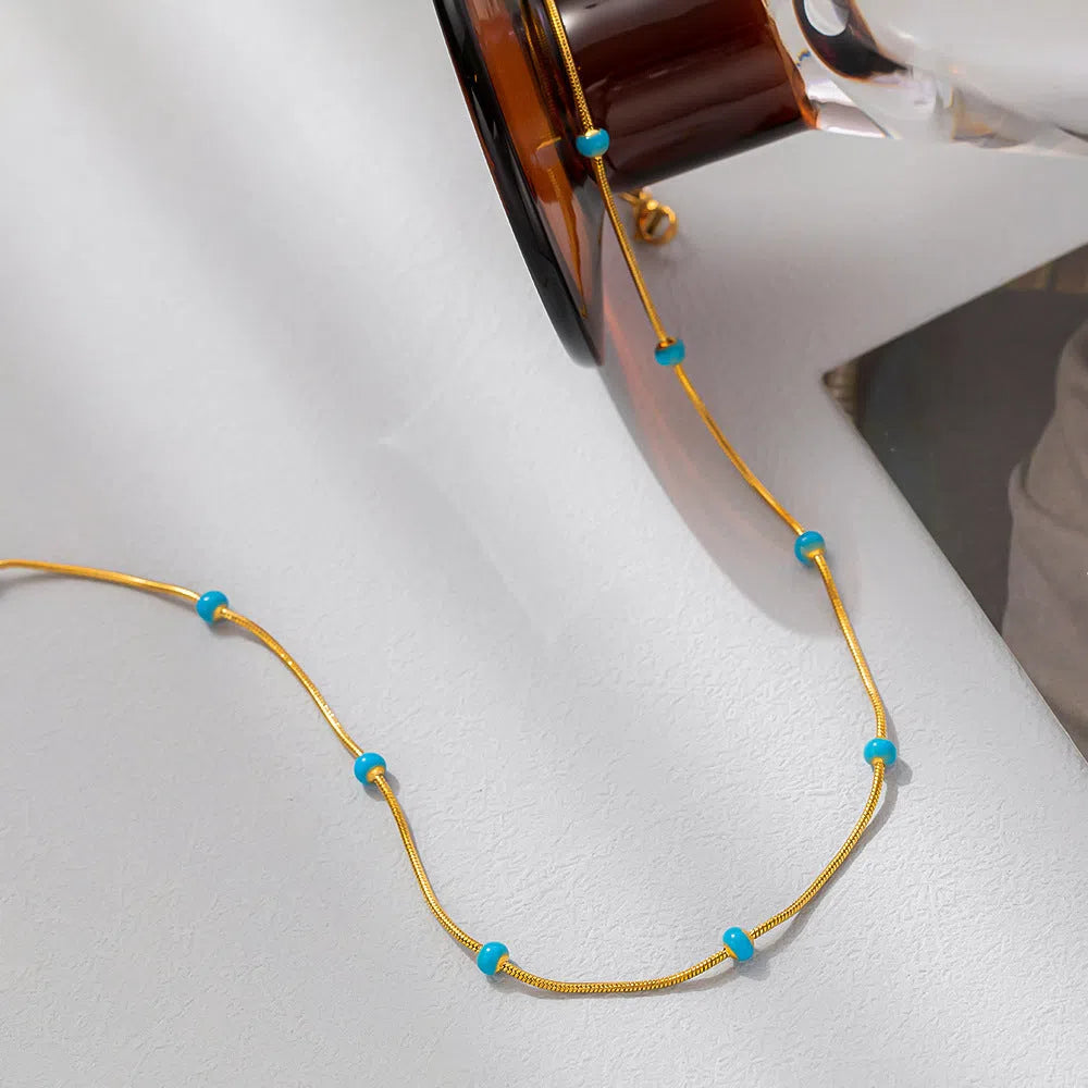 Titanium steel ball drop glaze necklace on stainless steel clavicle chain in Green Pearl Gold