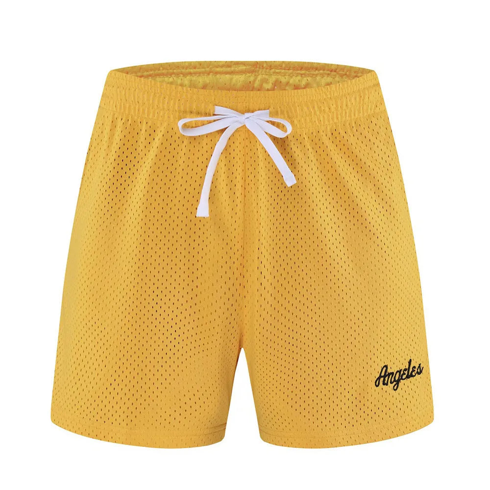 Men's black double-layer mesh sports shorts on a white background.