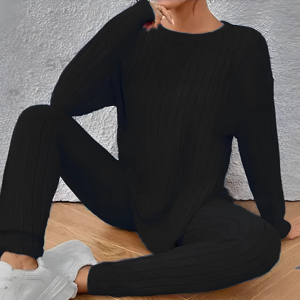 Black sunken stripe two-piece homewear set with pants and regular sleeve top on hanger