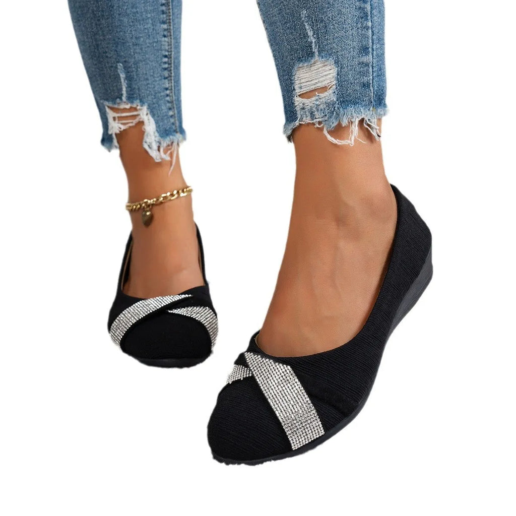 Black women's slip-on casual shoes with rhinestones on fabric upper and a chunky heel.