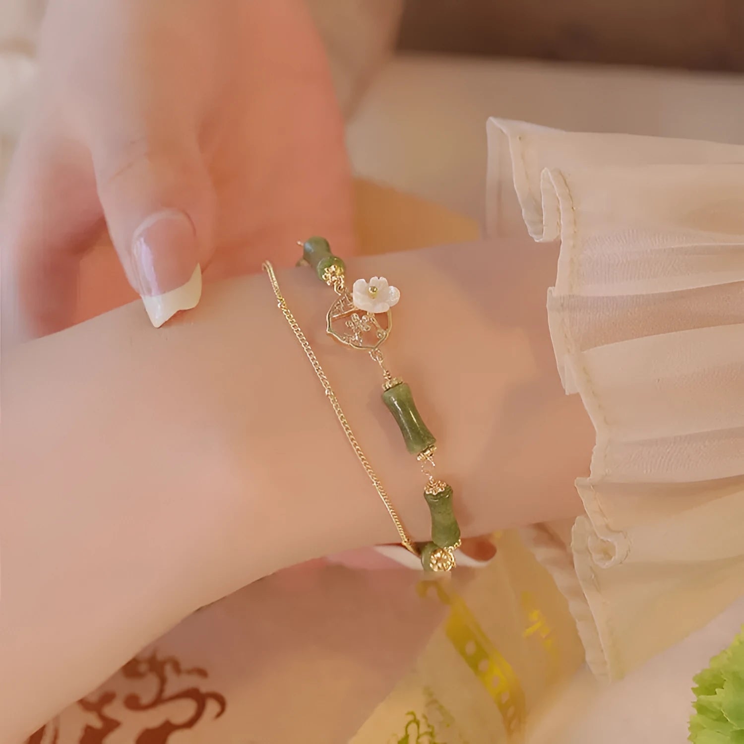 Natural olivine double layer bracelet with twin Bells of Ireland charms and olive branch design elements