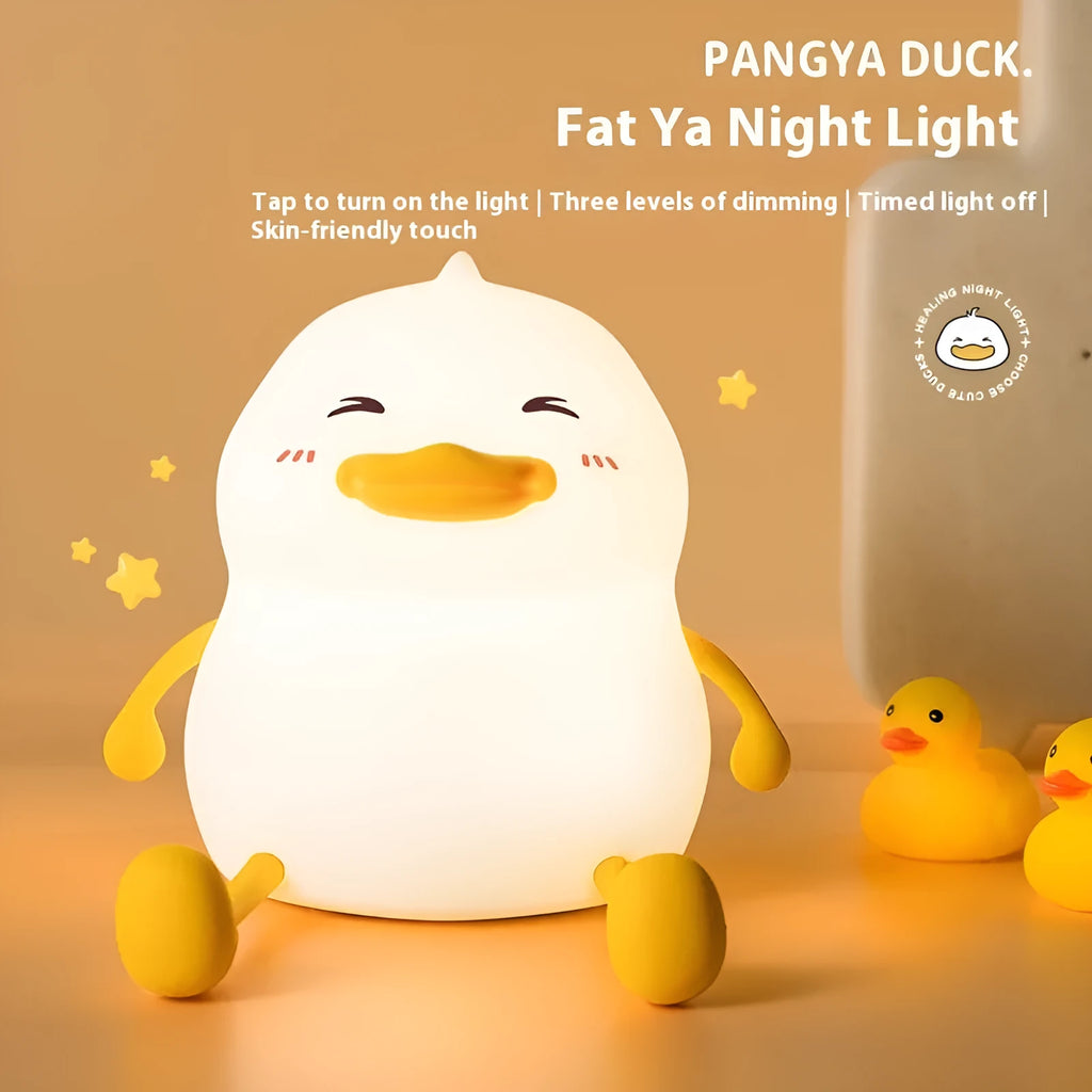 Chubby silicone night light with LED glow functioning as a desktop phone holder