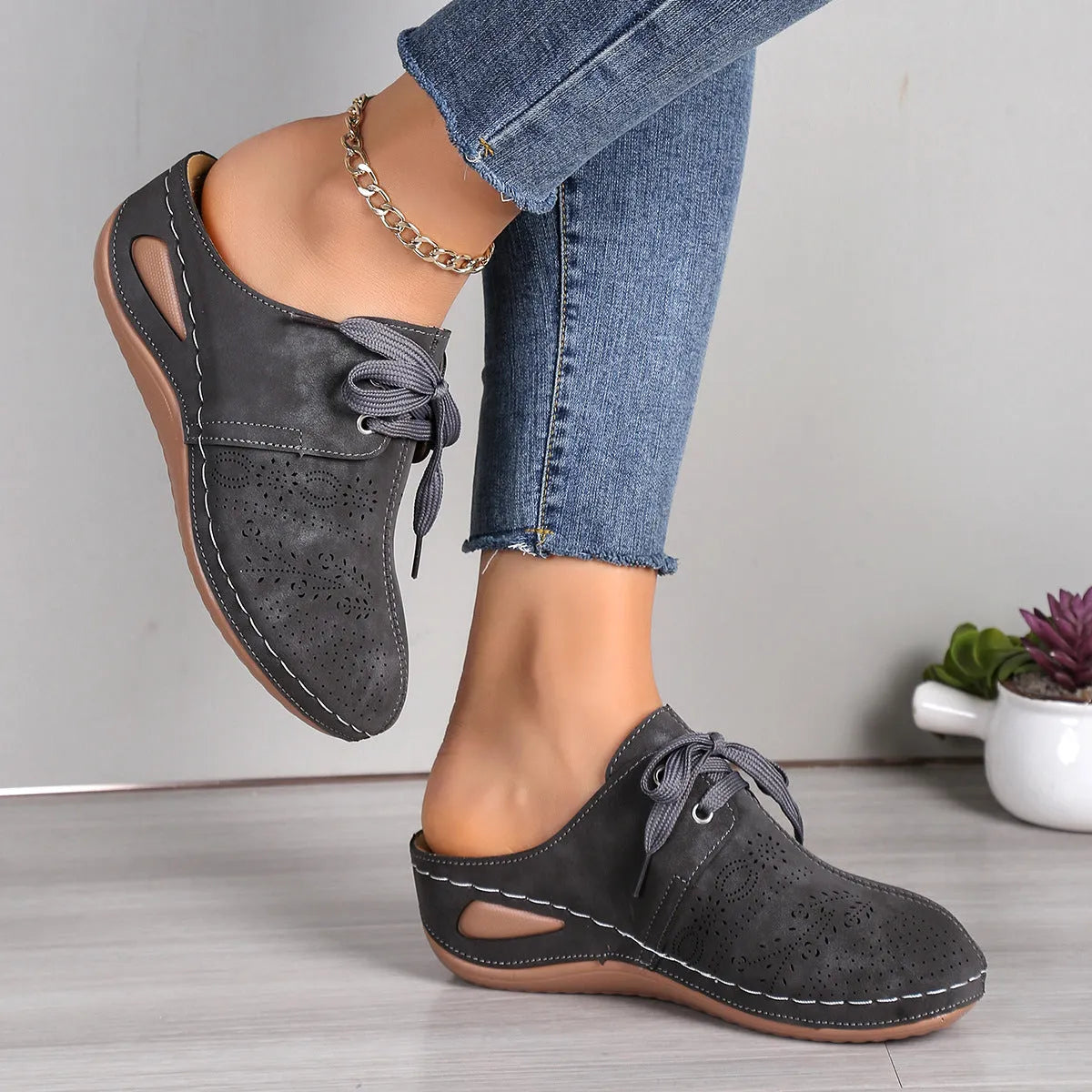 Women's lace-up summer slippers with suede upper, wedge heel, and rubber sole in various colours.