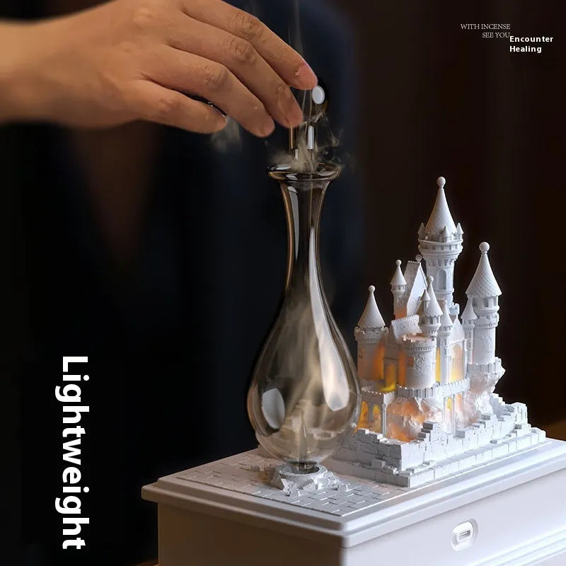 White medieval castle cold fragrance aromatherapy machine with ambient lighting on wooden surface