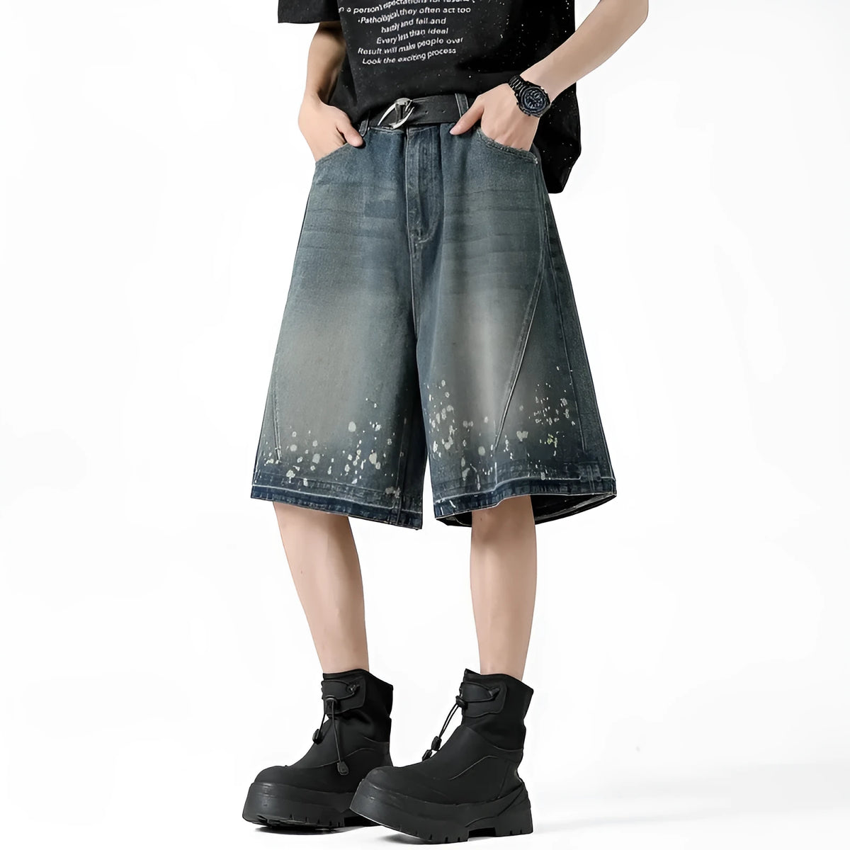 Men's retro blue washed denim shorts with ripped and splash ink distressing detail on straight-leg cut