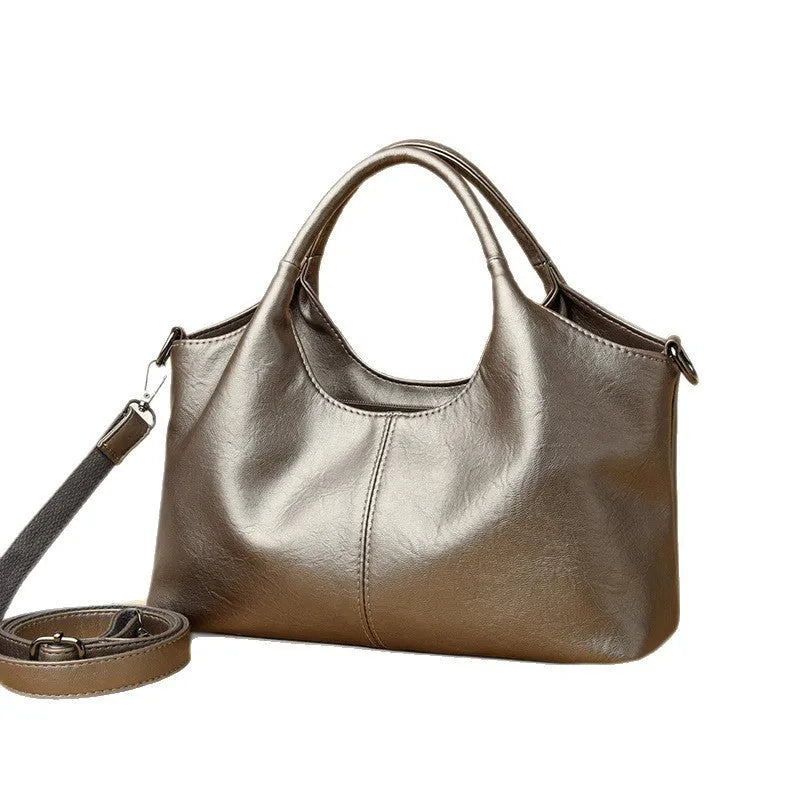 Genuine leather women's cross-body bag in seven colour options with large capacity interior
