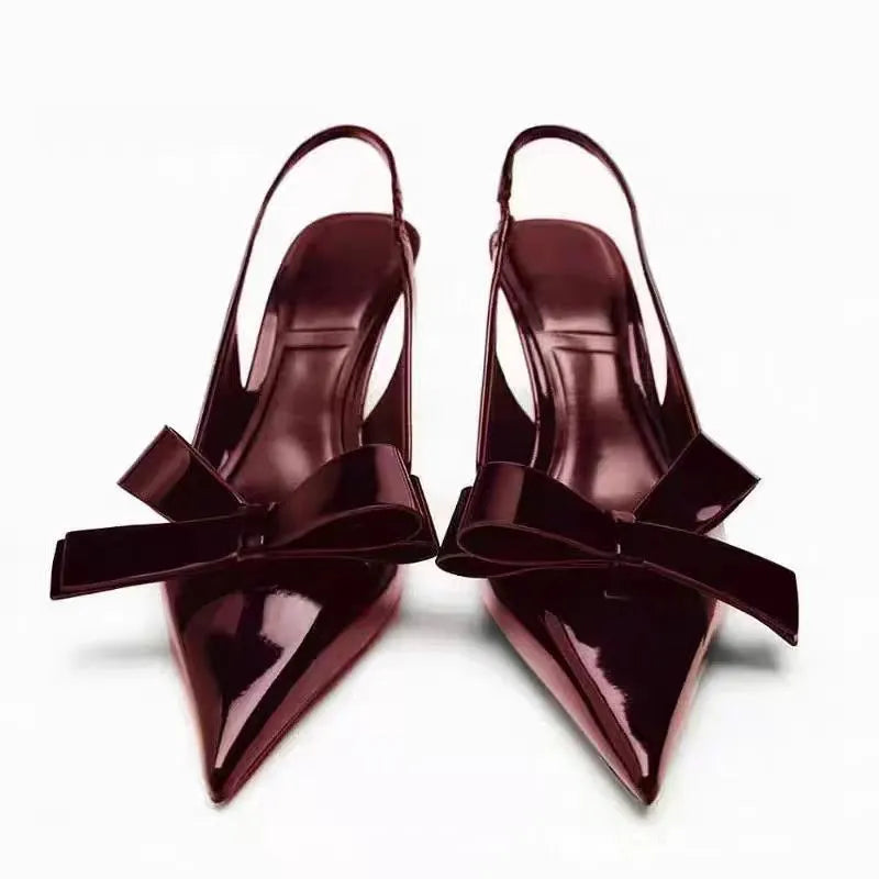 Wine red patent leather open-back high heels with bow detail and rear lacing
