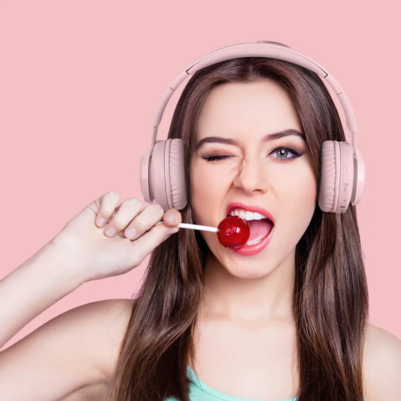 Wireless children's headphones with RGB LED lights in bunny pink colour showing power display