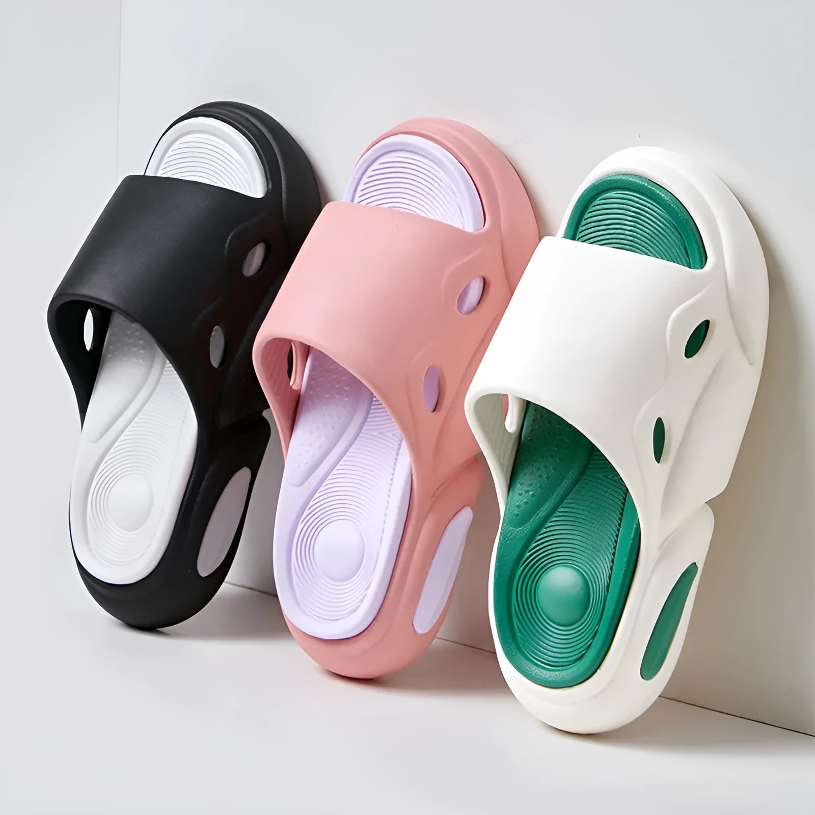 EVA thick-soled two-colour slippers for couples with leather lining shown in pink purple, white green, and black white colour options.
